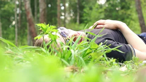 The man climbs in a grass Video stock 57336561