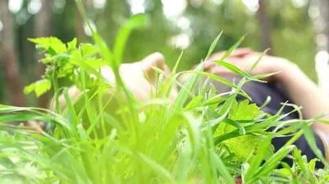 The man climbs in a grass Video stock 57336565