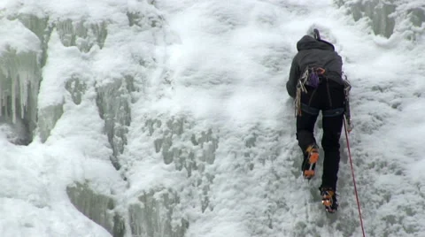 Man climbs ice Stock Footage 49648573
