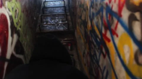 Man Climbs latter graffidi building Video stock 44573785