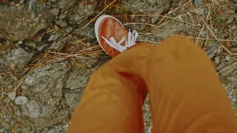 Man climbs mountain, view from above, legs walking, rock. Stock Footage 212012466