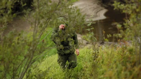 Man climbs up from the river bank Stock-Footage 93542419