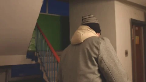 A man climbs the stairs. Stockbeeldmateriaal 73901550