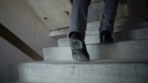 Man climbs the stairs Stock Footage 82066932
