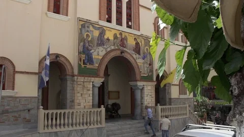 Man climbs steps and enters cathedral in Agios, Crete Video stock 83076367