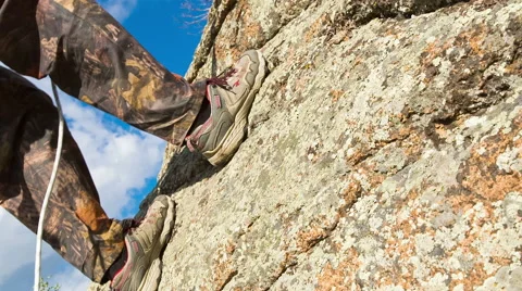 Man climbs up on top of the rock Stock Footage 40617893