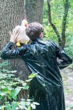 Man in a cloak with chicken Stock Photos