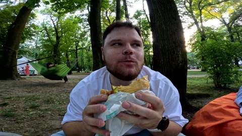 Man close up eating burger Stock Footage 252736502