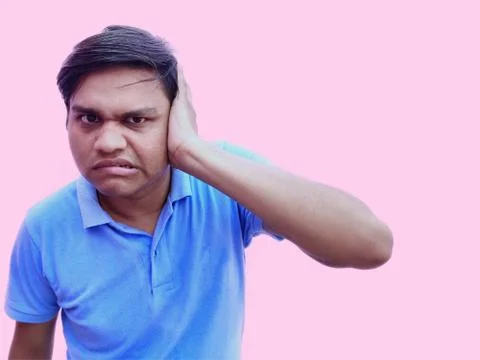 Man close his ear using hand Stock Photos