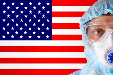 Man close-up in white protective suit, mask, glasses and gloves on the Stock Photos
