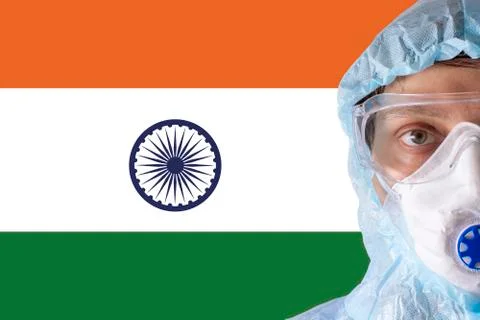 Man close-up in white protective suit, mask, glasses and gloves on the Stock Photos