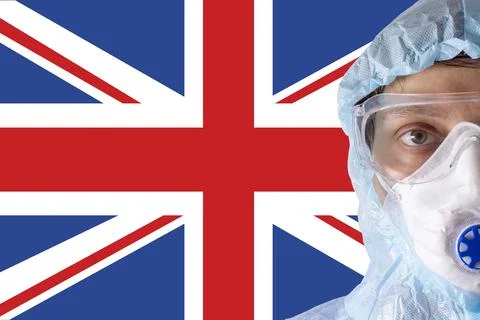 Man close-up in white protective suit, mask, glasses and gloves on the Stock Photos