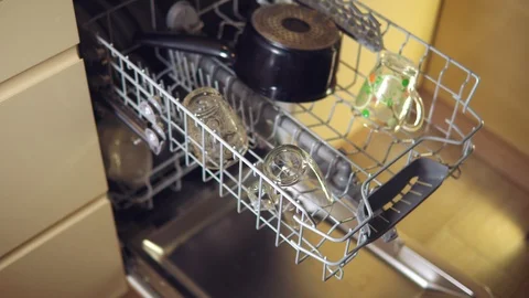 Man closes the dishwasher Stock Footage 101551000