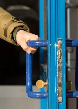 Man closes the door Stock Photos