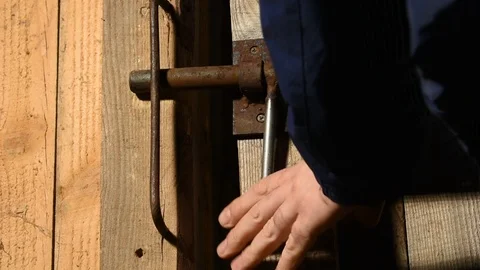Man closes an iron bolt Stock-Footage 122010138