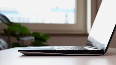 The man closes the laptop and clears the table Stock-Footage 244599143