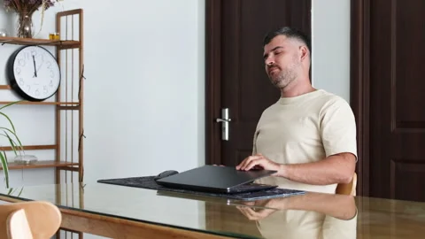 Man closes the laptop with pleasure. Stock Footage 314006772