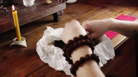 A man closes the outer packaging of Chinese pressed tea Stock Footage 139331504