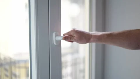 Man closes a plastic window Stock Footage 232530001