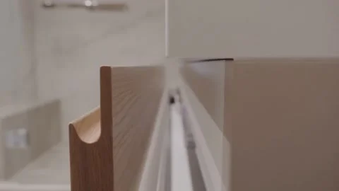 A man closes the shelf in the Cabinet Stock-Footage 130180868