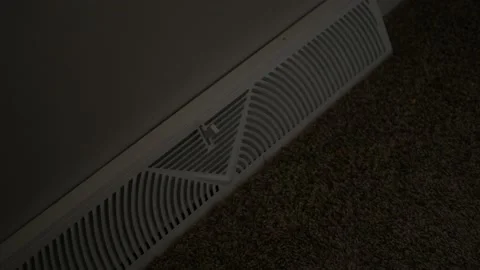 Man closes vent of a floor diffuser Stock Footage 222188959