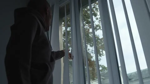 Man closes the window after airing the room. Stock Footage 286333541