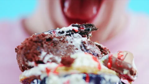 Man closeup bites dessert. Stock Footage 90339613