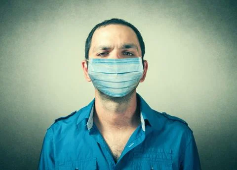 Man closeup with the protective mask Stock Photos