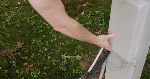 Man Closing Campground Hookups Lid for RV and Campers with Water and Electric Stock Footage 111983608