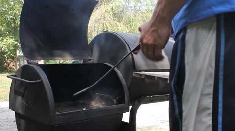 Man Closing Grill Stock Footage 61197119
