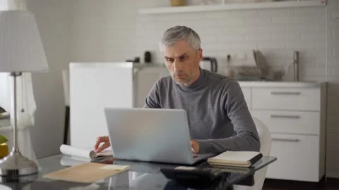 Man closing pc and thinking at home Stock Footage 133529274
