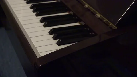 Man closing piano Stock Footage 75149509