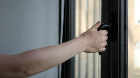 Man closing a window slow motion Stock Footage 93748749