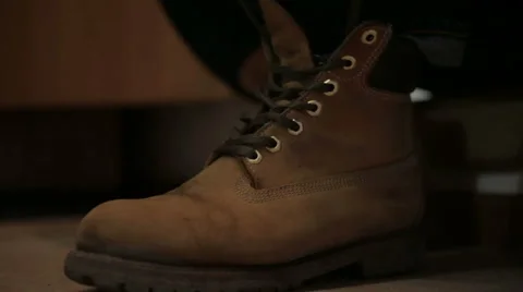 Man clothes and tying his shoes Stock Footage 60080377