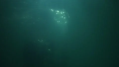 A man in clothes is drowning under water Stock Footage 165243545