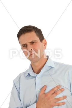 Man clutching his chest with his hand Stock Photos