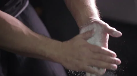 Man coating his hands in powder chalk magnesium. Ready for workout Stock-Footage 54199998