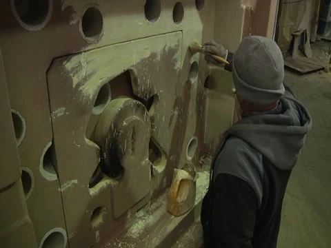 Man Coats Mold Stock Footage