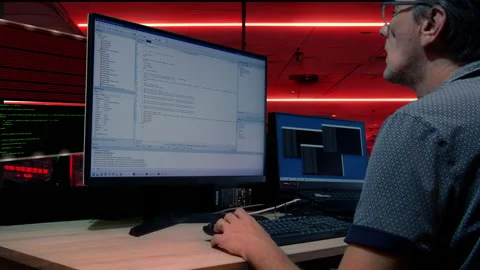 The man codes at a crazy pace in the Delphi programming language. Stock Footage 218580345