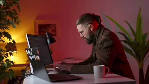 Man coding on computers Video stock 168909395