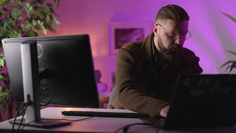 Man coding at home Stock Footage 168909919