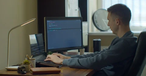 Man coding html and programming on screen Monitors, development web, developer. Stock Footage 129444135
