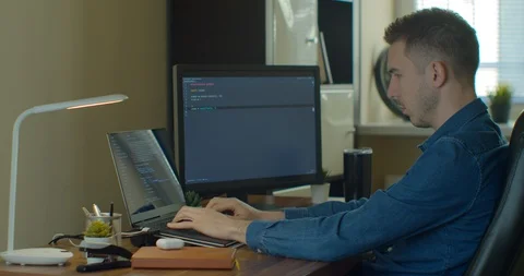 Man coding html and programming on screen Monitors, development web, developer. Stock Footage 129446645