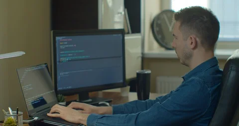 Man coding html and programming on screen Monitors, development web, developer. Stock Footage 129447078
