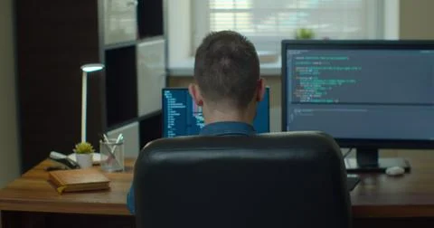 Man coding html and programming on two screen Monitors, development web Foto stock