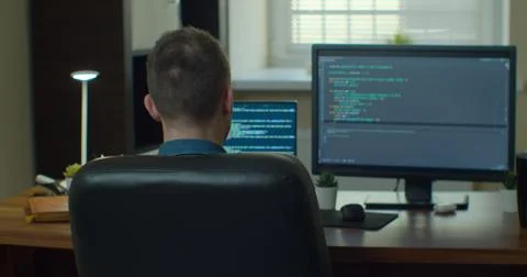 Man coding html and programming on two screen Monitors, development web Stock Photos