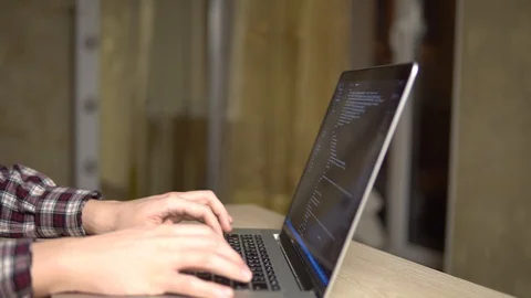 Man coding html code web developer freelance programmer working Stock Footage 127057429