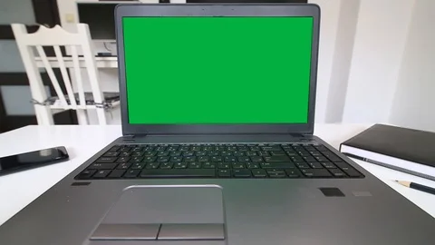 Man coding on a laptop with green screen Stock Footage 128475140