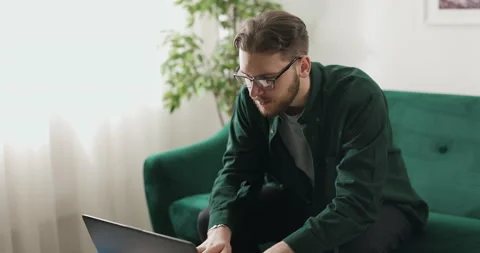 Man coding on laptop home Stock Footage 189061220