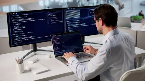 Man Coding On Laptop In Office, Focused Stock Footage 333848597
